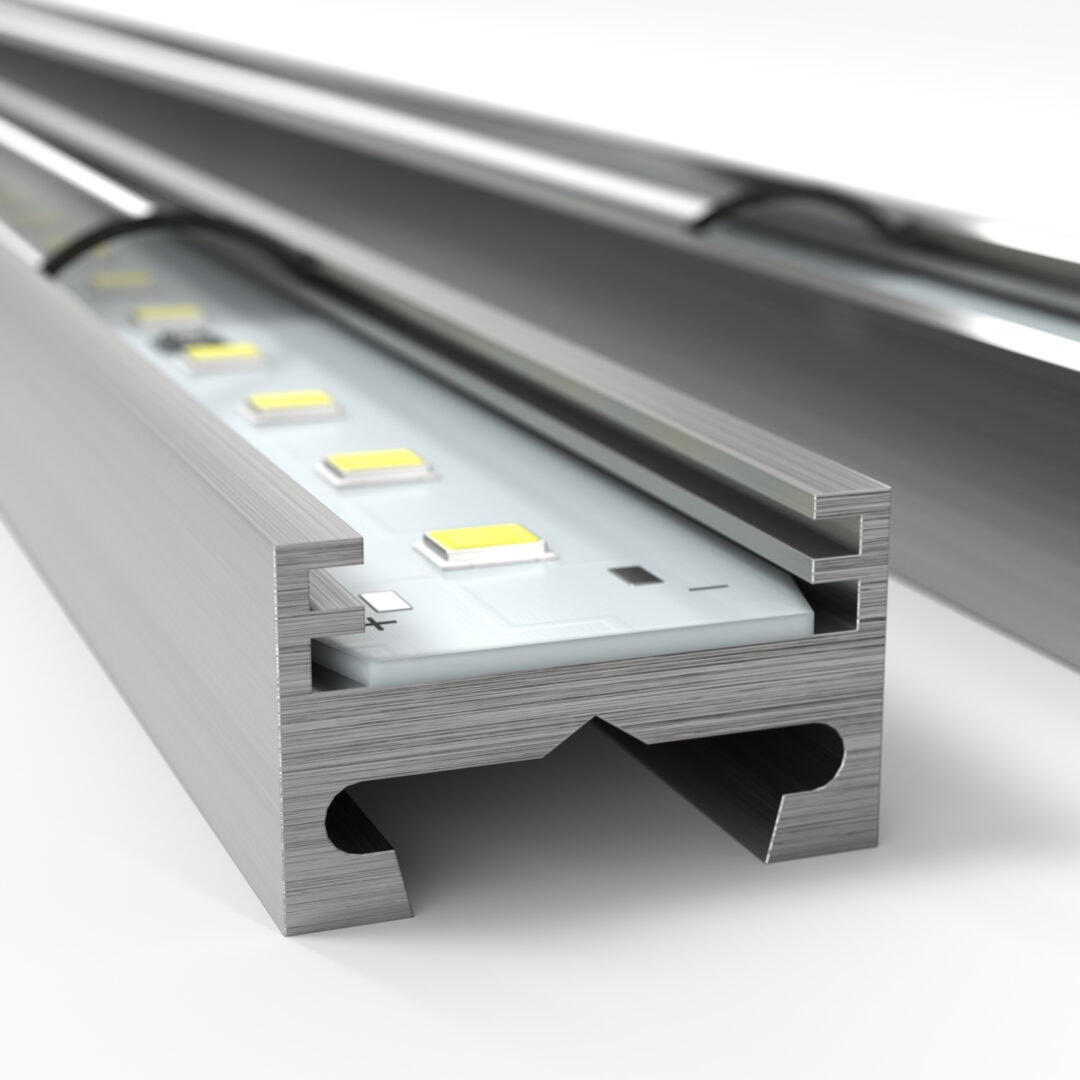 Nahaufnahme eines beleuchteten Aluminium-Profils mit integrierten LED-Lichtern, geeignet für Shop- oder Ladenbau.